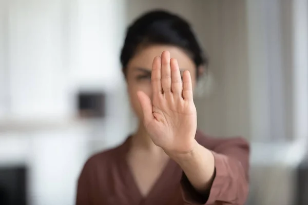 Courageous young female extend hand in stop gesture saying no — Stock Photo, Image