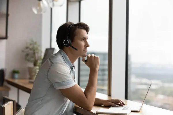 Pensive millennial man in headset have webcam call — Stock Photo, Image