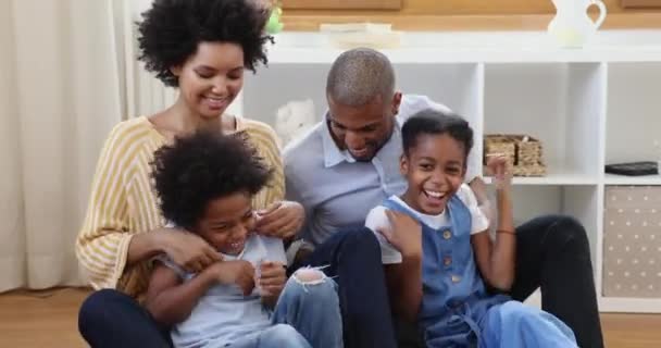 Beautiful African couple tickling little son and pre-teen daughter — Stock Video