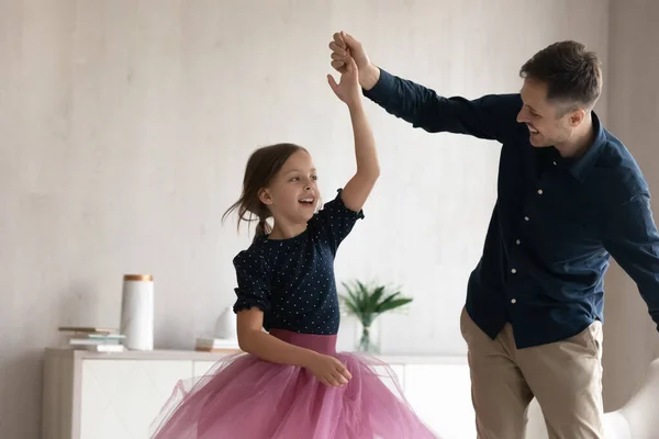 Happy young latin father dancing with small daughter. — Stock Photo, Image
