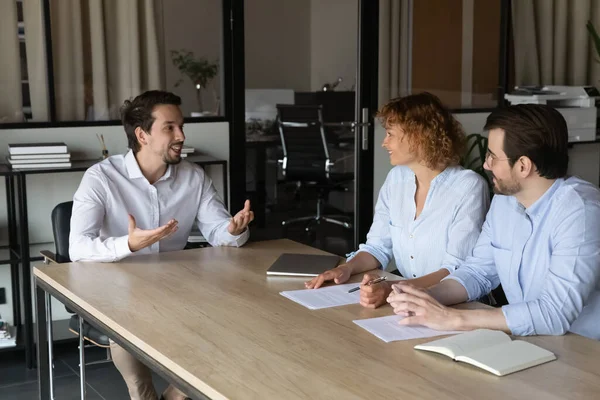 Happy business team leader talking to employees on corporate meeting — Stock Photo, Image