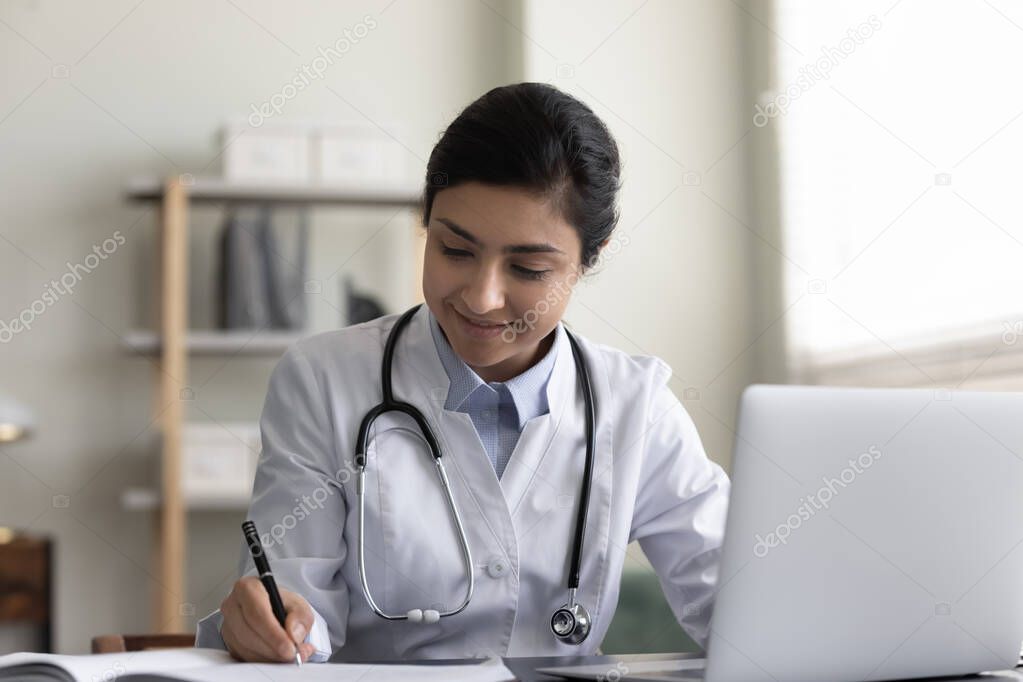 Smiling friendly GP doctor giving online distance video consultation