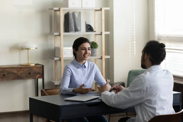 Happy Indian woman consulting young male doctor at appointment — Stock Photo, Image