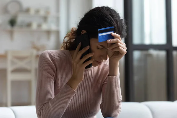 Unhappy woman distressed with credit card debt — Stock Photo, Image