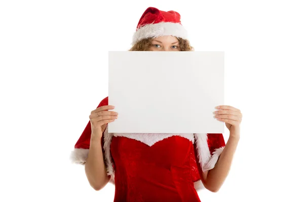 Santa girl hides behind blank paper — Stock Photo, Image