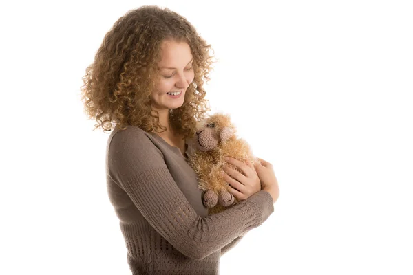 Girl holds stuffed toy sheep — Stock Photo, Image