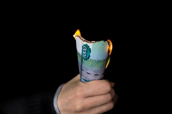 Pack of burning rubles in person's hand horizontal — Stock Photo, Image