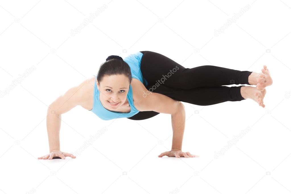 Yogi female in yoga asana Two-Legged Koundinya's Pose