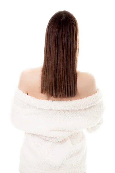 Sexy young female taking off white bathrobe, back view — Stock Photo, Image