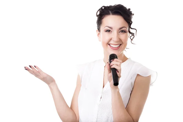 Young businesswoman announcer with microphone on white backgroun — Stock Photo, Image