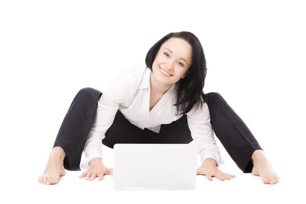 Young office woman with laptop exercising on white background — Stock Photo, Image