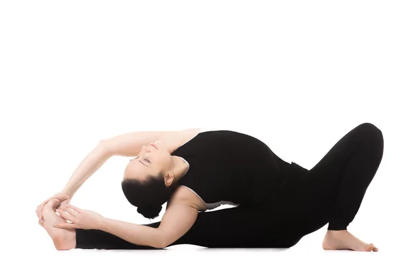 Yogi female in yoga Head-to-Knee Forward Bend Pose — Stock Photo, Image