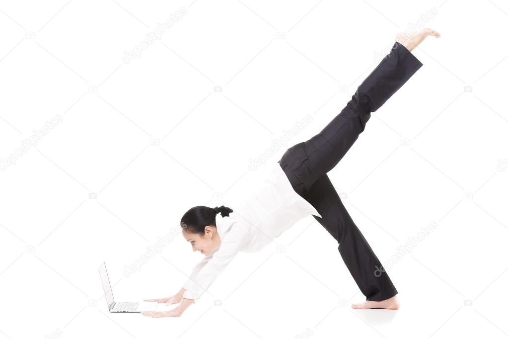 Young office woman in yoga pose holding laptop on white backgrou