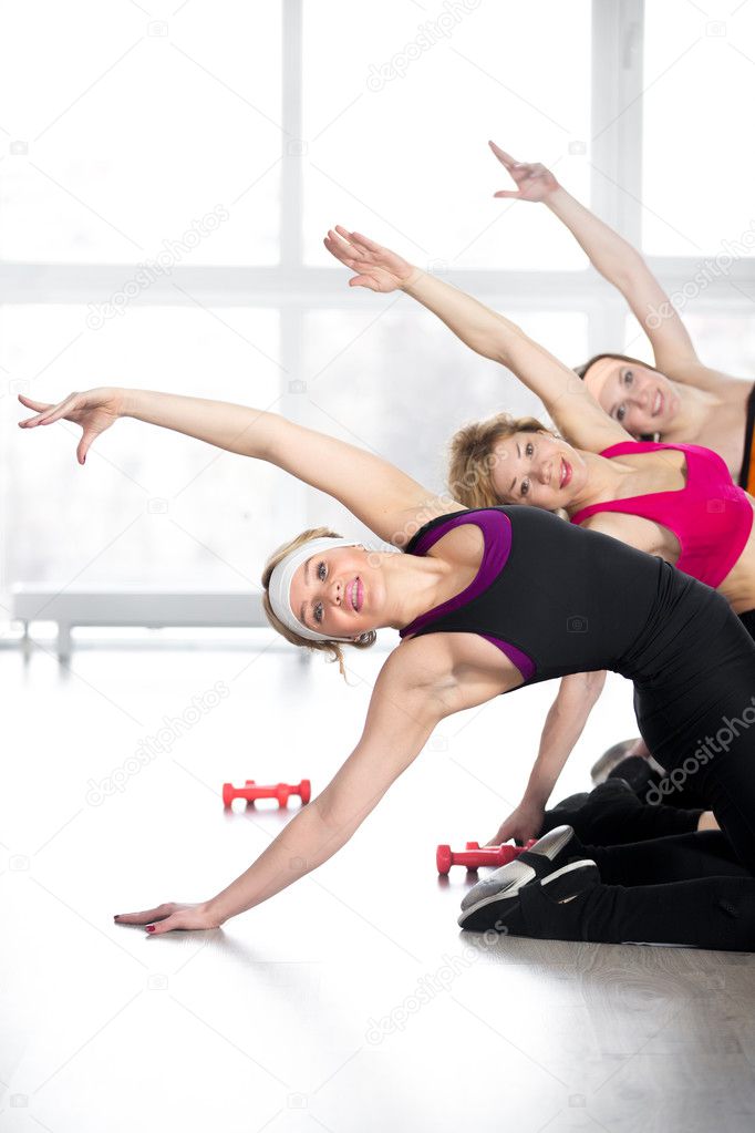 Group of women doing fitness training in class
