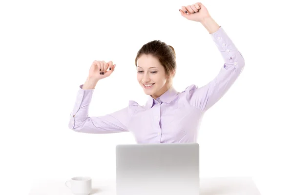 Young girl raising arms with happy expression in front of laptop — Stock Photo, Image