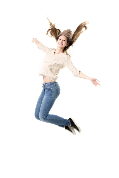 Beautiful teenage girl jumping high with delight — Stock Photo, Image