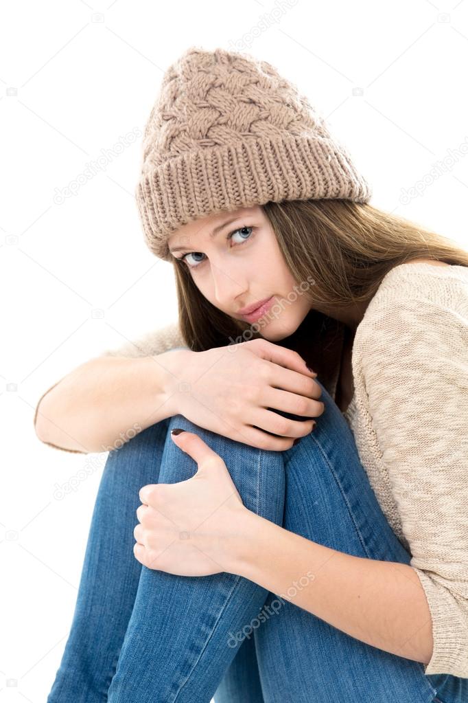 Frightened teenage girl curled-up