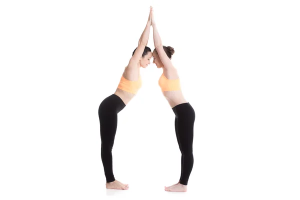 Two beautiful girls warming up before sport practice — Stock Photo, Image