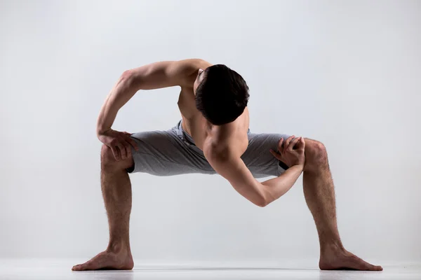 Temple twist yoga pose — Stock Photo, Image