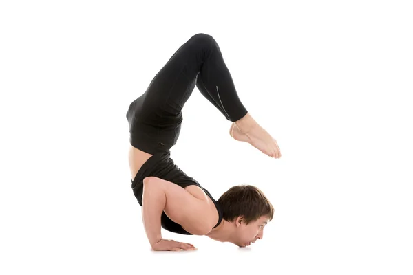 Sporty young man doing backbend — Stock Photo, Image