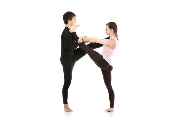 Acro yoga extended hand-to-big-toe pose — Stock Photo, Image