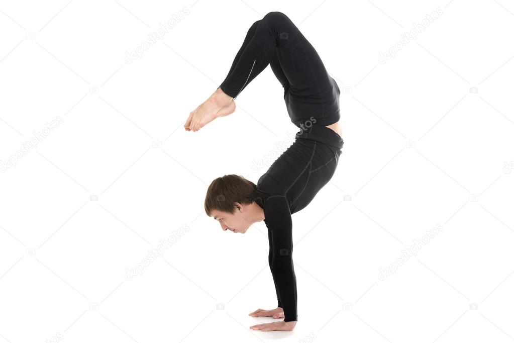 Yogi male in yoga Scorpion Pose Vrischikasana 2