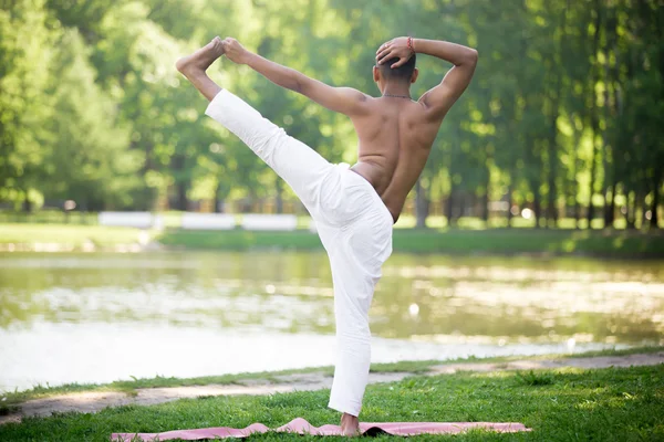 Indian young man practicing yoga