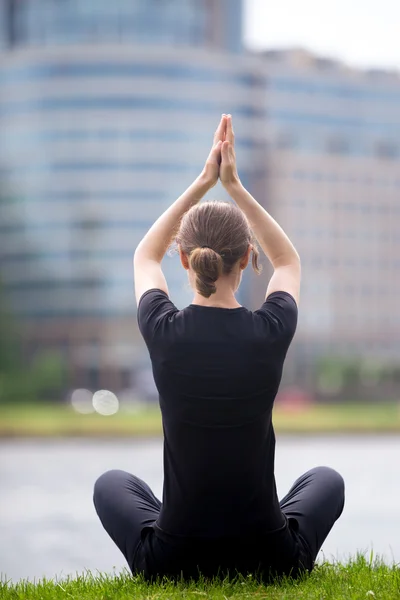 Business woman sitting in yoga pose — Stock Photo, Image