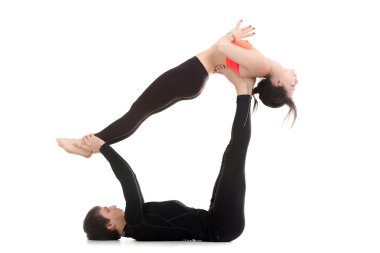 Couple doing acro yoga