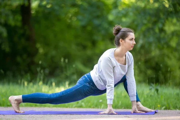 Stretching exercises in park alley — Stock Photo, Image