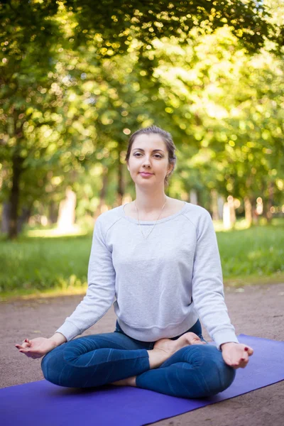 Half lotus yoga pose — Stock Photo, Image