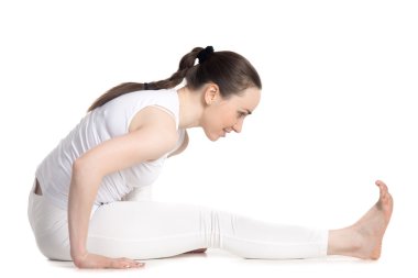 Cheerful teenager girl doing yoga practice