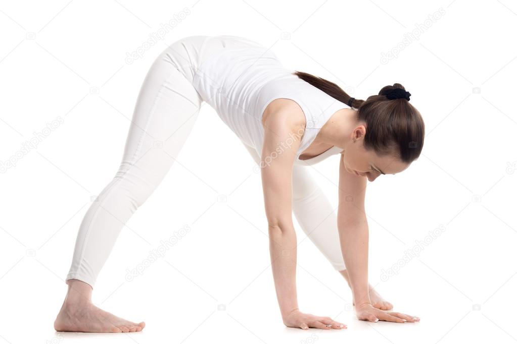 Yogi female doing Standing Straddle Forward Bend