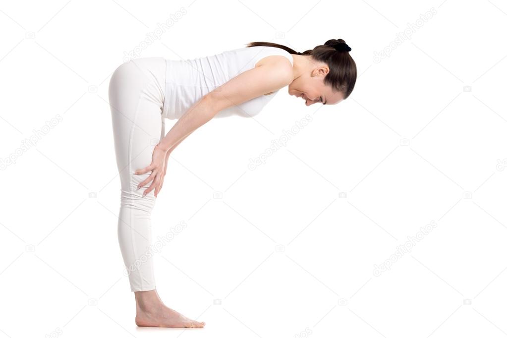 Yogi female standing in Half Forward Bend asana