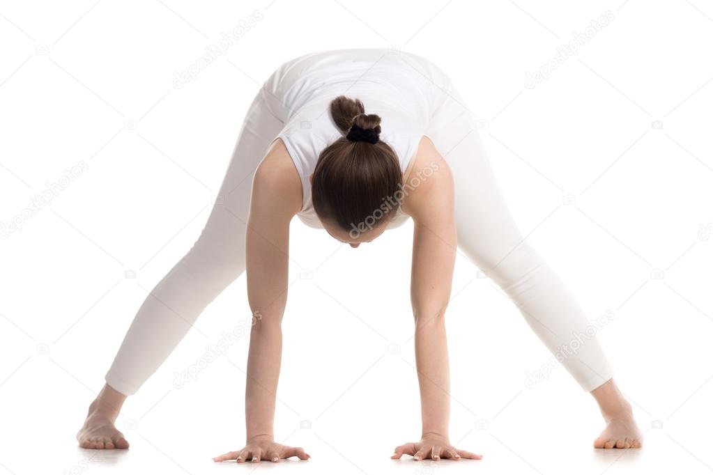 Yogi female doing Prasarita Padottanasana pose
