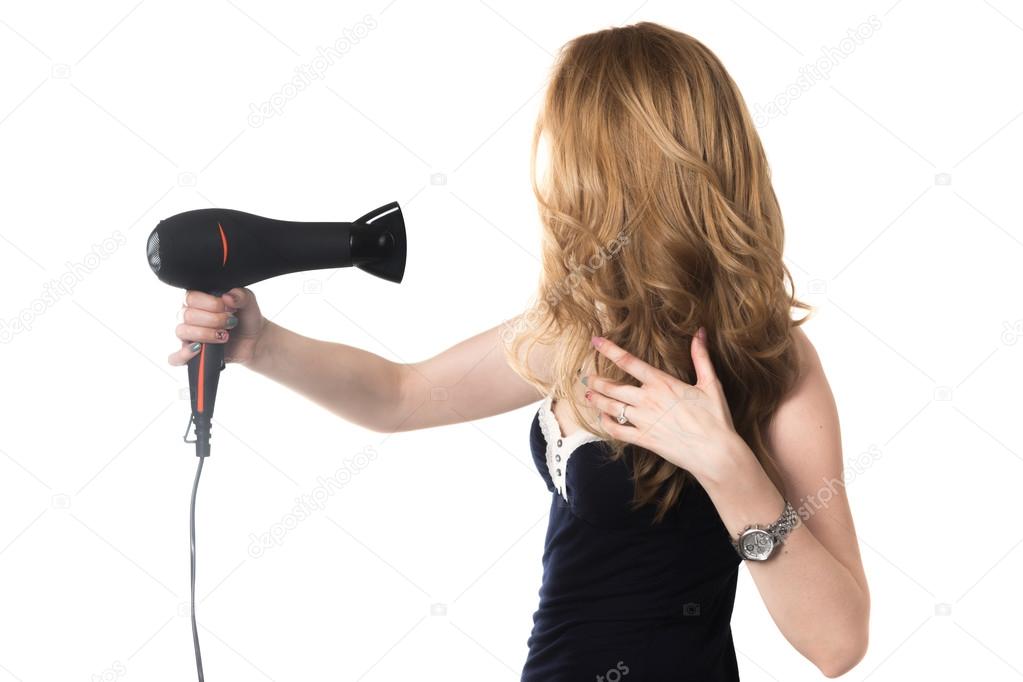 Girl using hairdryer 