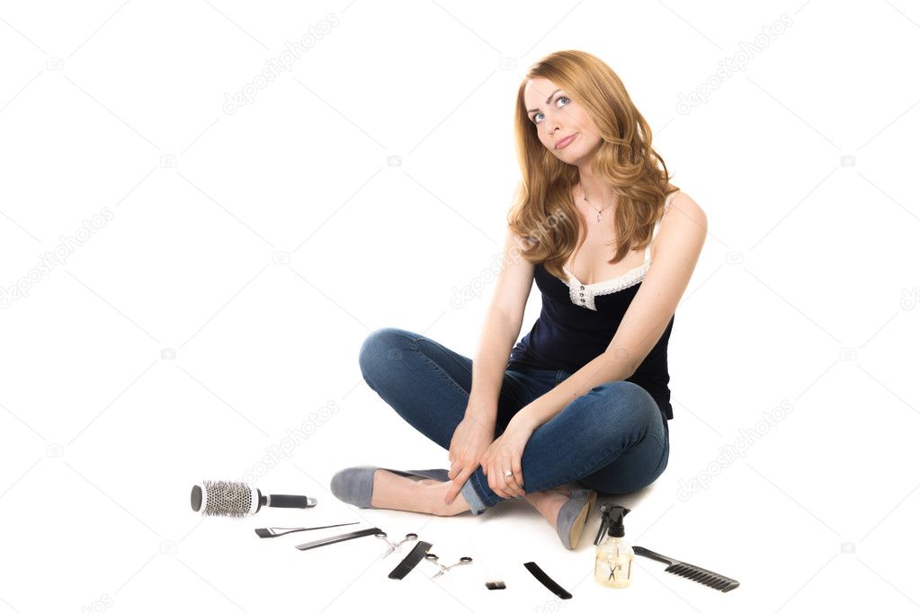 Young woman in front of barber equipment