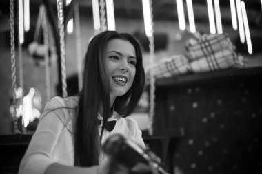 Black and white photo of smiling bartender girl