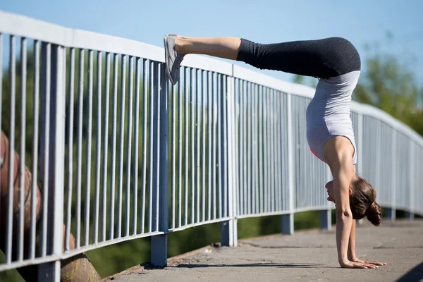 Street yoga: Downward facing Tree Pose variation — Stock Photo, Image