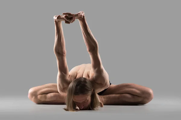 Variation of baddha konasana yoga pose — 图库照片