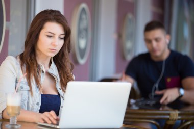 Good-looking young woman at a cafe