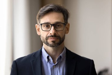 Self confidence in work. Head shot portrait proud successful young businessman in formal suit glasses manager executive corporate employee leader business owner looking at camera on profile picture
