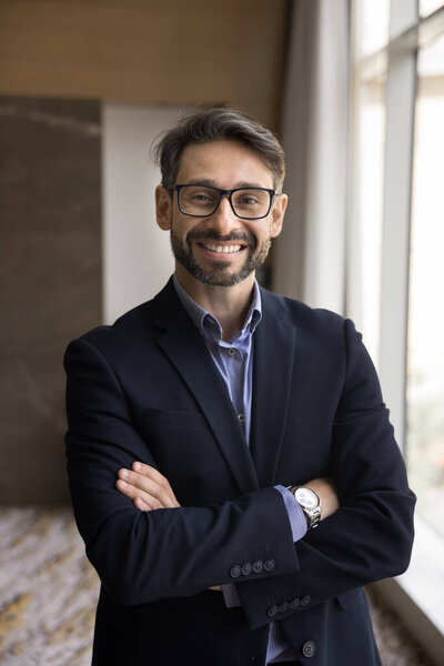 Successful entrepreneur. Vertical portrait smiling confident millennial male business leader corporate boss ceo look at camera feel happy succeeding in career enjoy own company growth wellbeing wealth