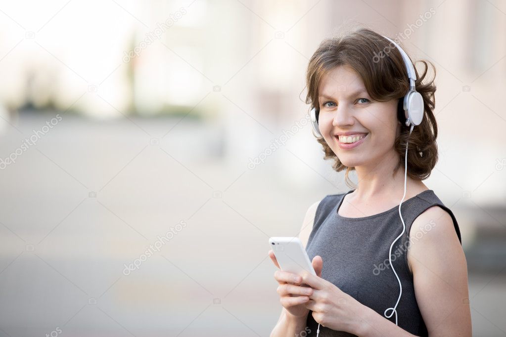 Smiling female listening music online