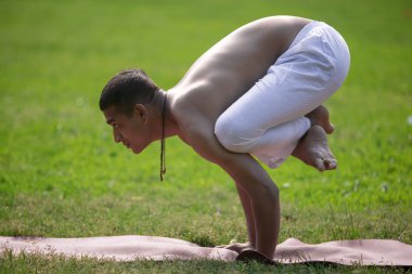 Variation of bakasana yoga Pose