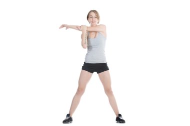 Sporty woman stretching shoulder blade