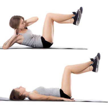 Sporty woman doing exercises for abs