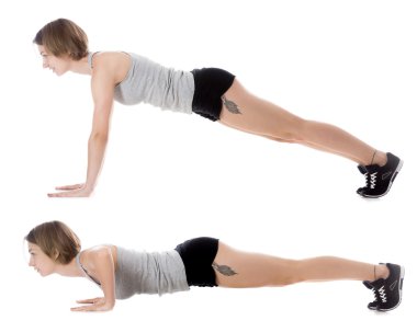 Sporty woman doing pushups