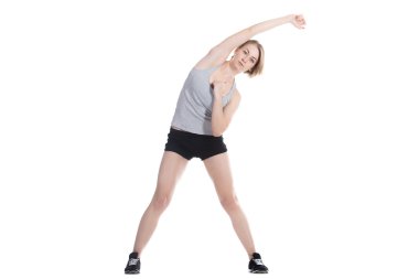 Sporty woman doing side bends