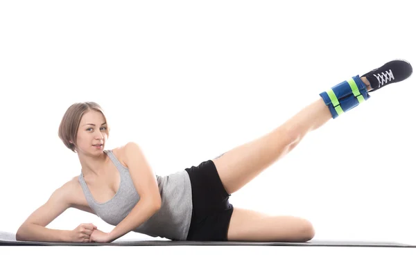 Sporty woman doing exercises for waist — ストック写真